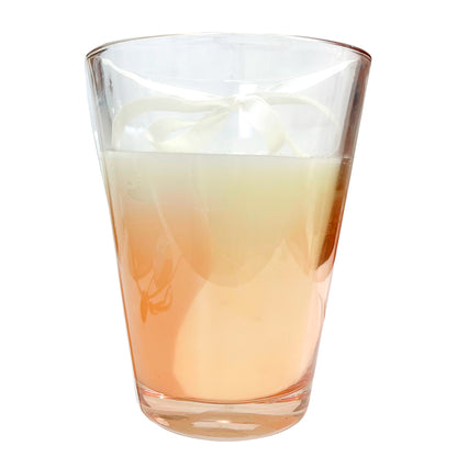 Vela aromática Home Deco Factory beige de 23 cm con vaso de vidrio.